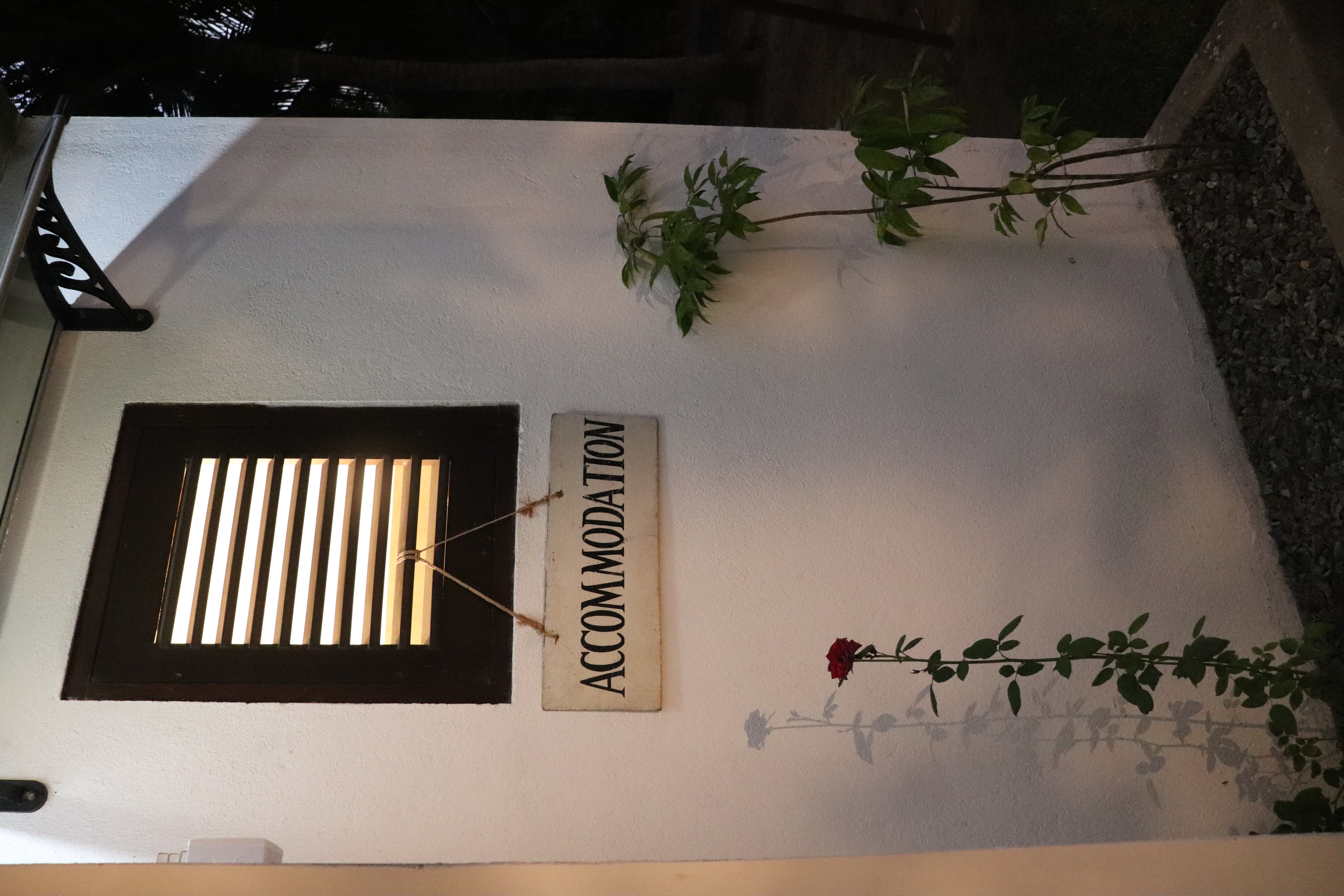 Villa name sign wall and entrance detail