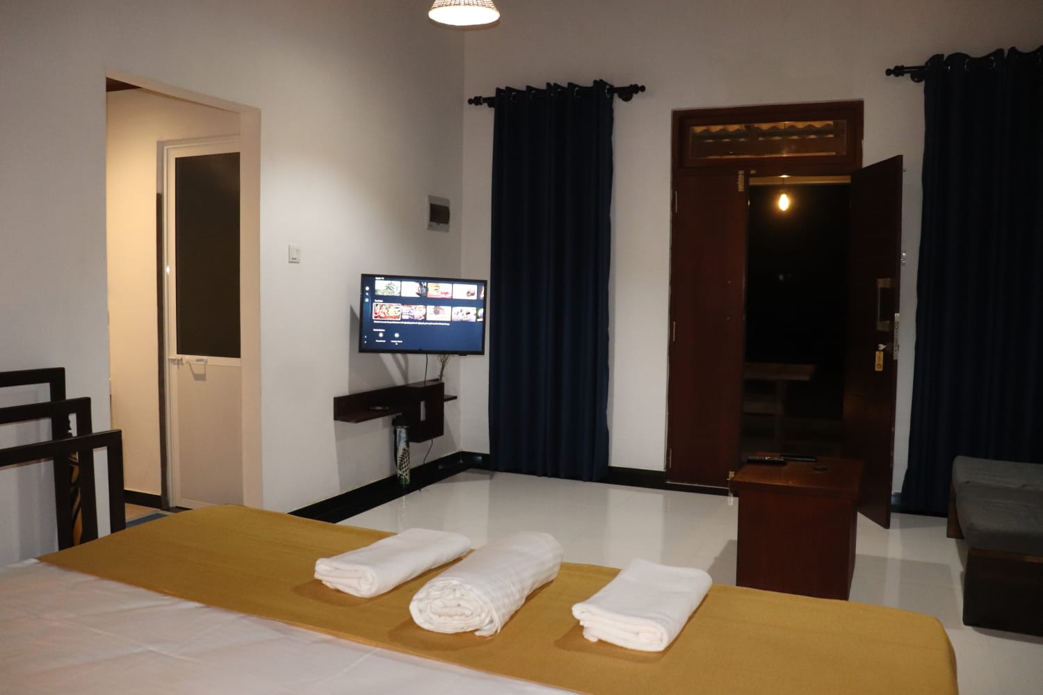 Wide room overview with bed and seating